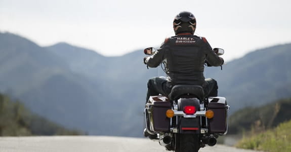 Motorcycle rider wearing a Harley Davidson jacket