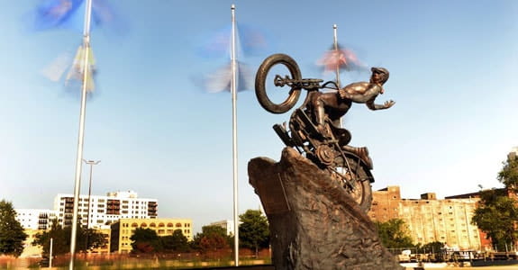 Statue of a motorcycle climbing a hill
