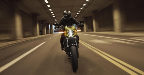 Motorcycle riding through a tunnel