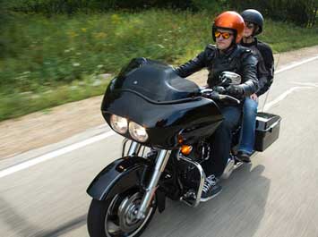 Two people riding a motorcycle