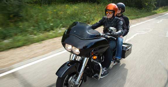 Two people riding a motorcycle
